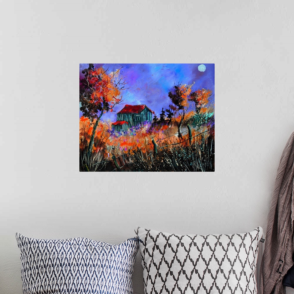 A bohemian room featuring Vibrant painting of a fall day with golden trees, a colorful sky, and a barn in the distance.