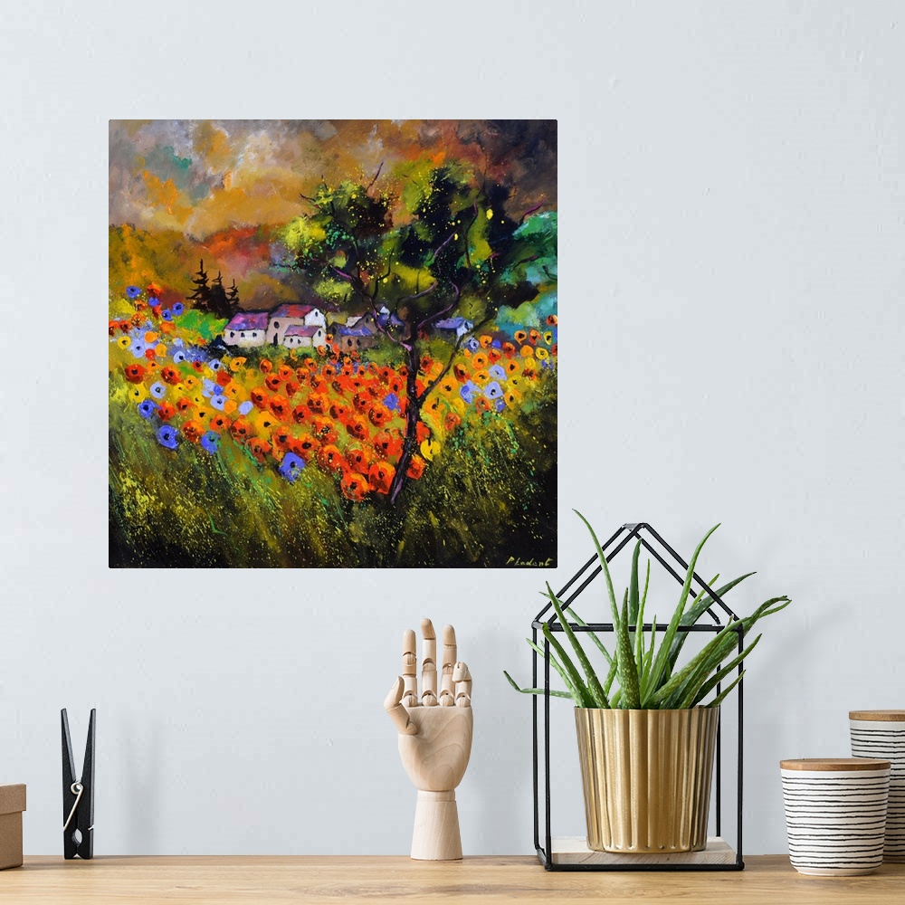 A bohemian room featuring Contemporary painting with a field of poppy flowers in the foreground and a village in the backgr...