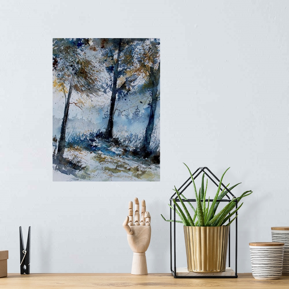 A bohemian room featuring A vertical watercolor landscape of a forest with muted speckled colors of brown and blue.