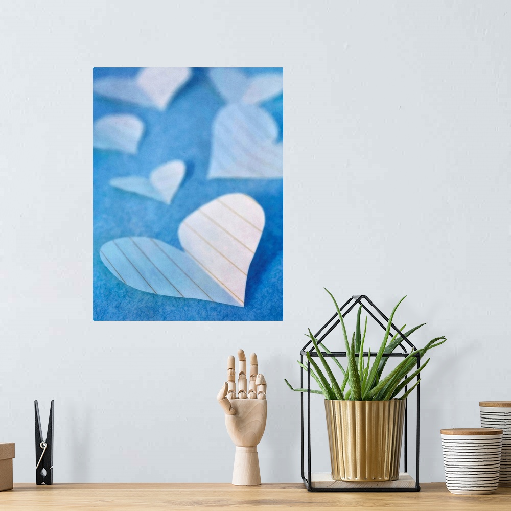 A bohemian room featuring Paper hearts, a sweet still life in blue tones