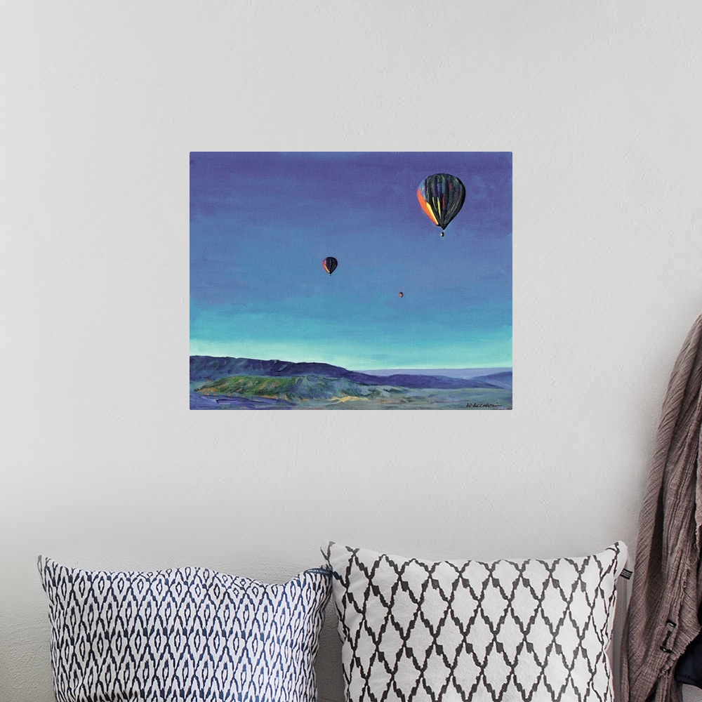 A bohemian room featuring Contemporary painting of three hot air balloons over a rural San Diego landscape.