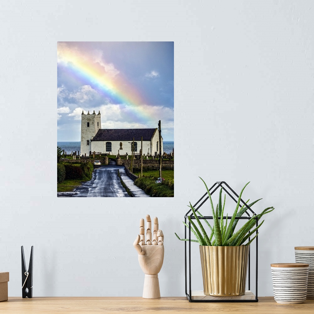 A bohemian room featuring Photograph of Ballintoy Parish Church with a beautiful rainbow behind it over the ocean, at Balli...