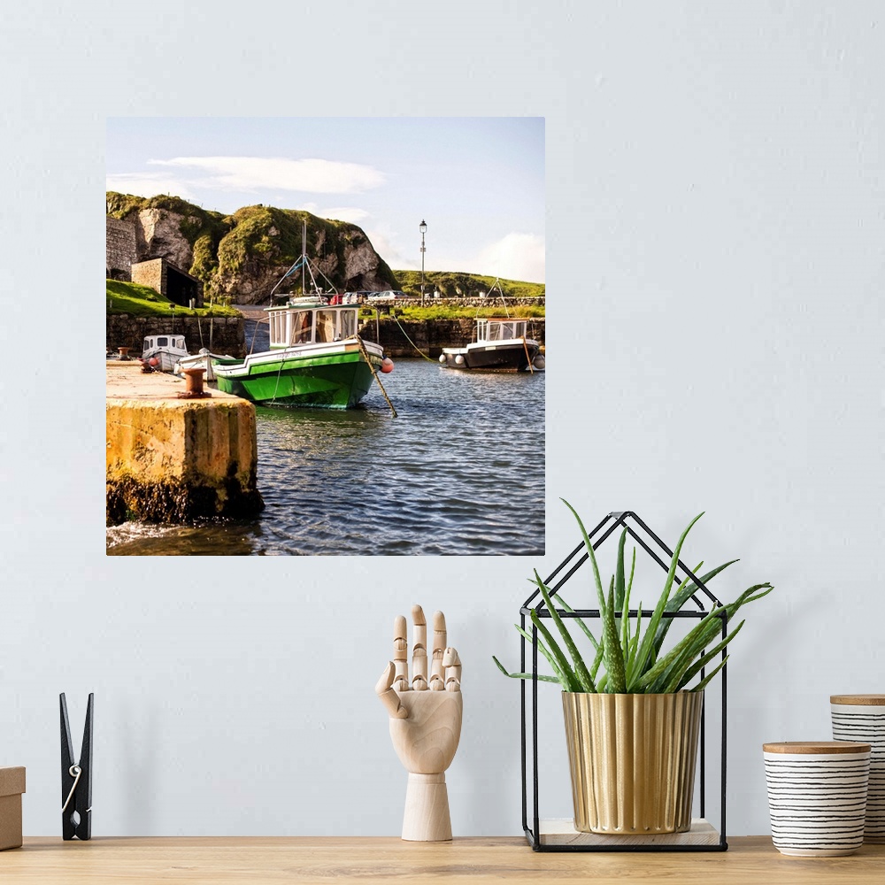 A bohemian room featuring Square photograph of docked boats on the coast in Dublin, Ireland.