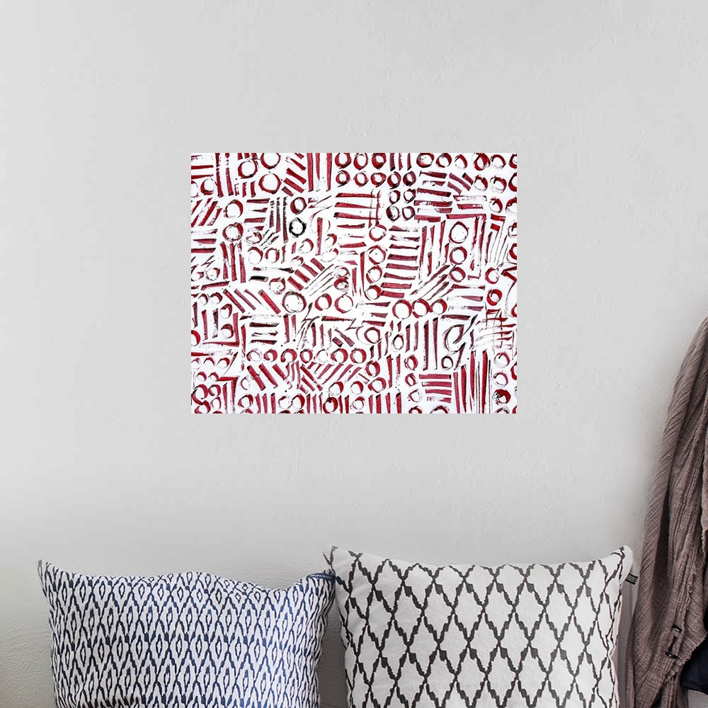 A bohemian room featuring Abstract contemporary artwork made of red circles and lines.