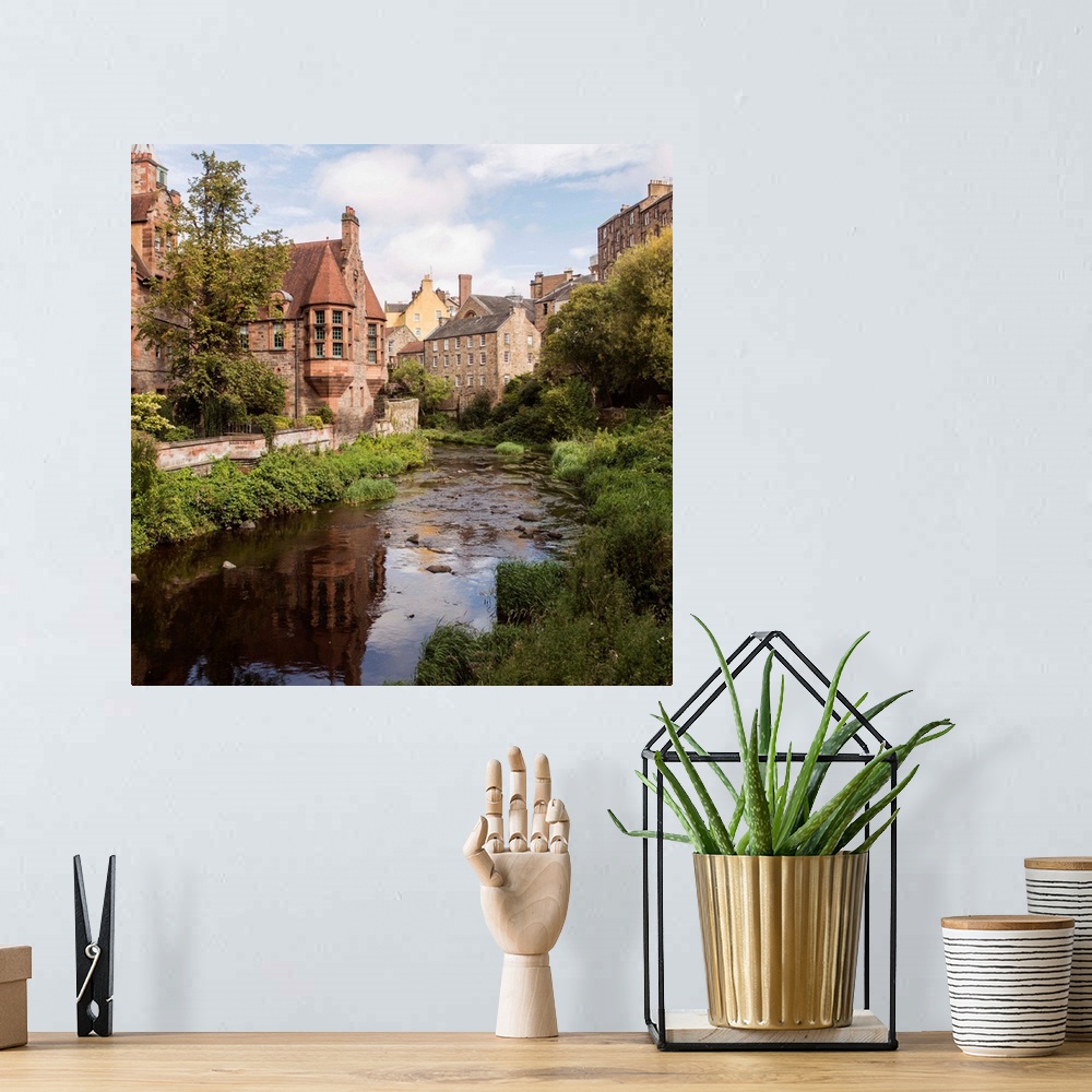 A bohemian room featuring Square photograph of picturesque Dean Village with Water of Leith flowing throwing through the mi...