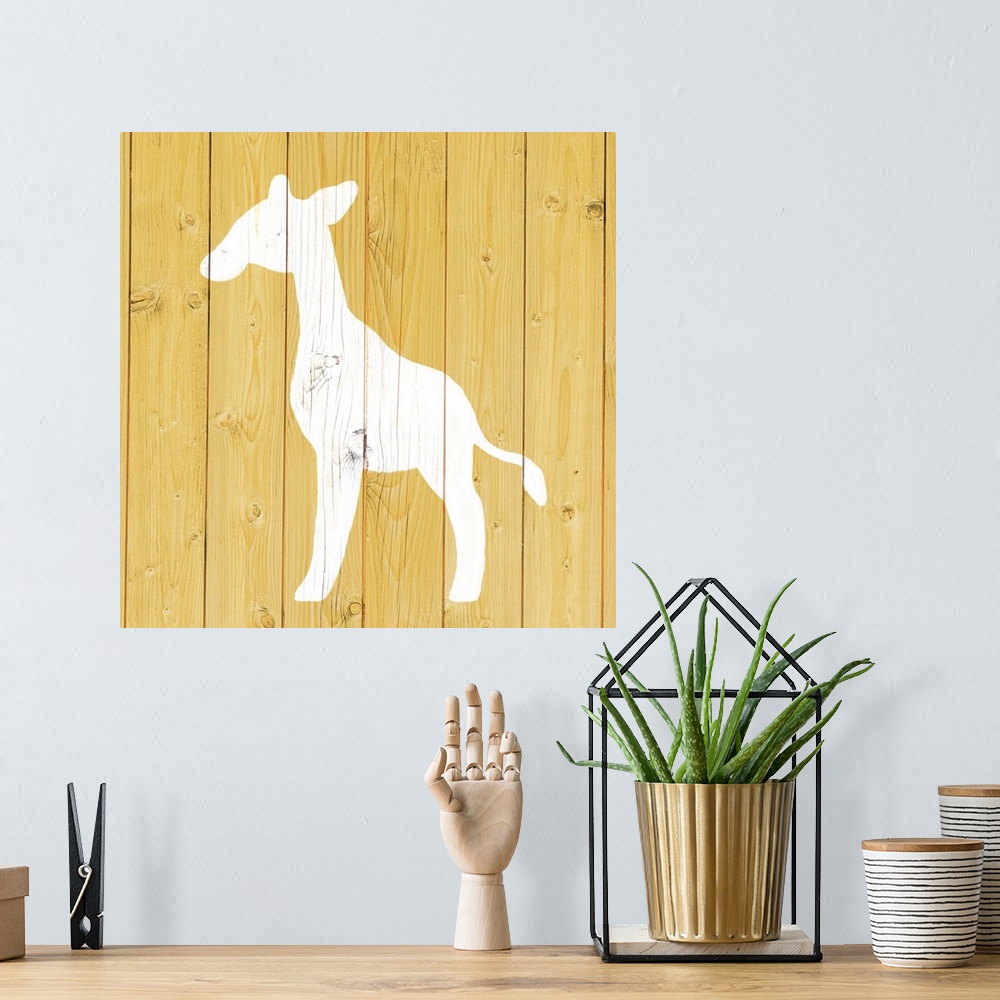 A bohemian room featuring Nursery art of a giraffe outline painted on a yellow board background.
