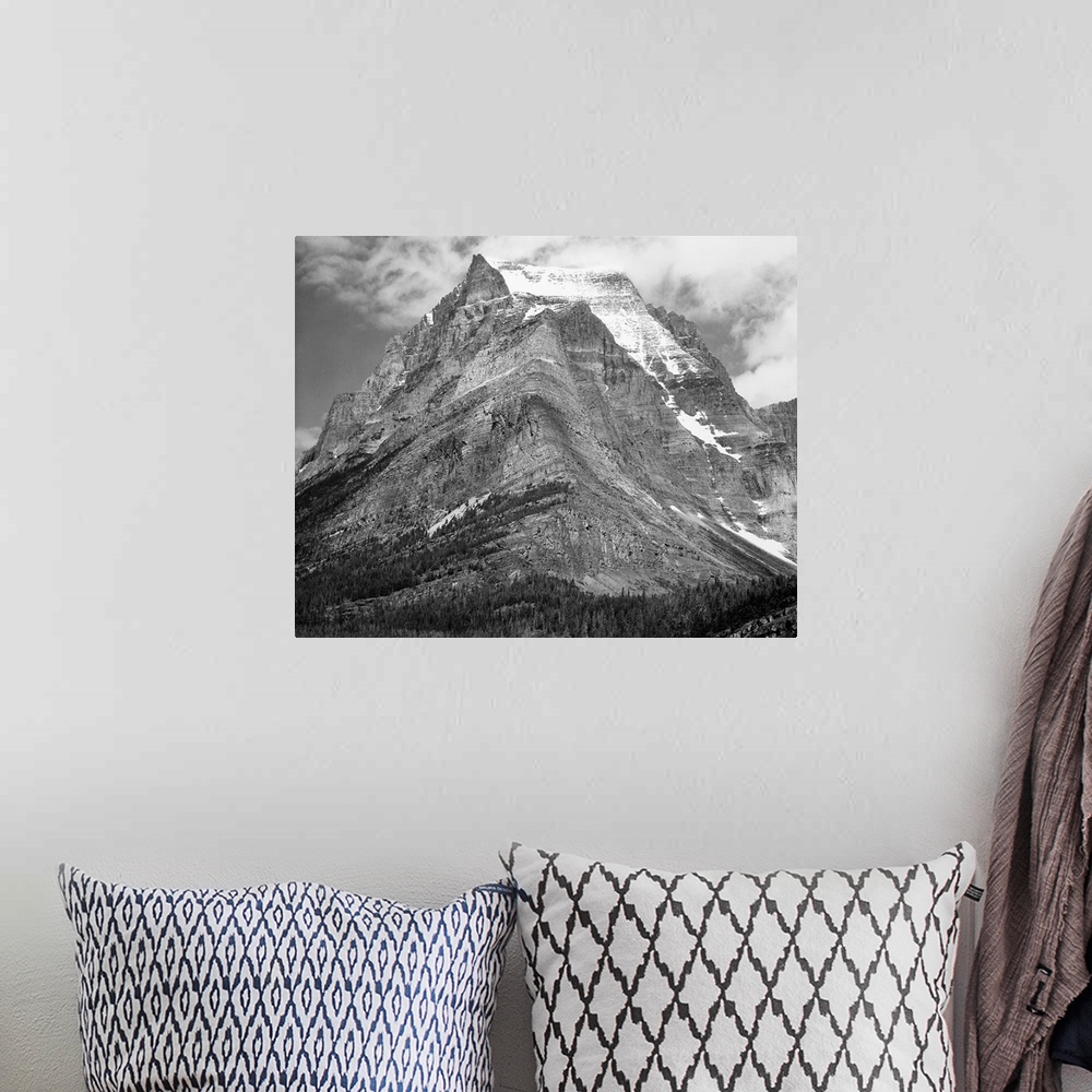 A bohemian room featuring Going-to-the-Sun Mountain, Glacier National Park, full view of mountain.