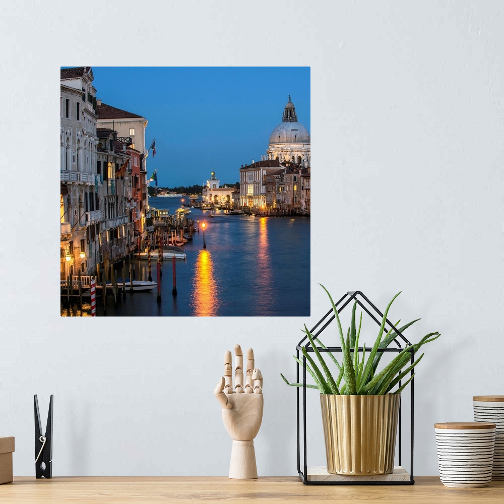A bohemian room featuring Square photograph of Grand Canal lit up at night with the Santa Maria della Salute in the backgro...