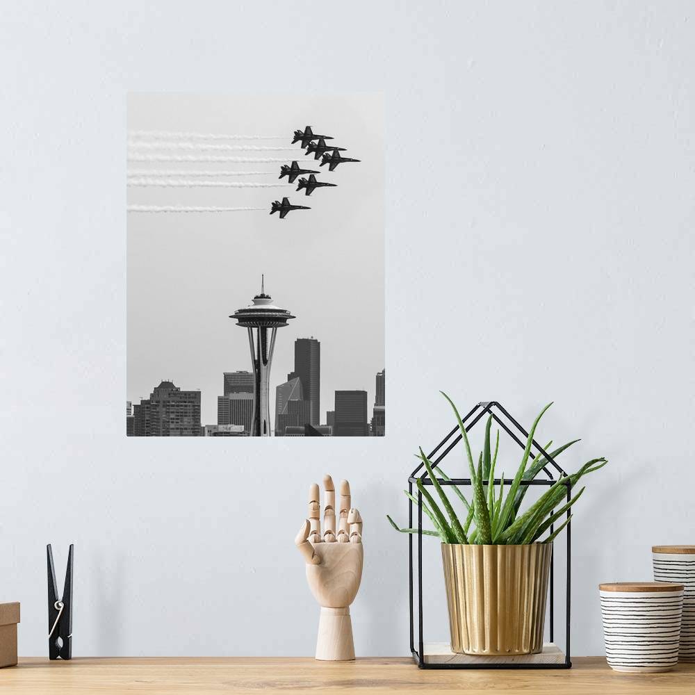 A bohemian room featuring Black and white photograph of Navy jets flying over the Seattle Space Needle.