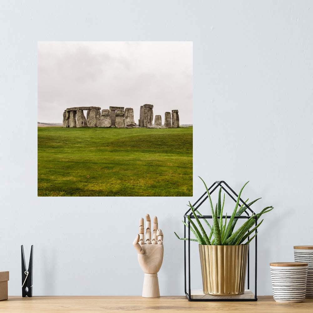 A bohemian room featuring Square photograph of Stonehenge, a prehistoric monument and now a historic landmark in Wiltshire,...