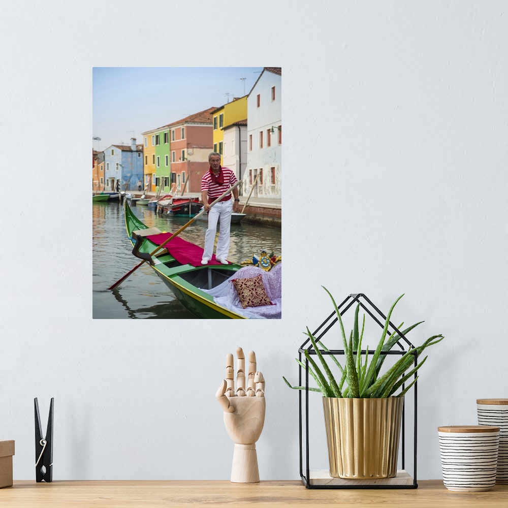 A bohemian room featuring Photograph of a gondolier wearing a red and white striped shirt, rowing through a canal lined wit...
