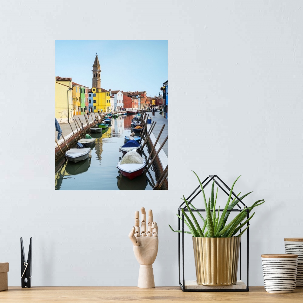 A bohemian room featuring Photograph of docked gondolas in a small canal in the Venetian Lagoon in Burano, Venice, Italy wi...