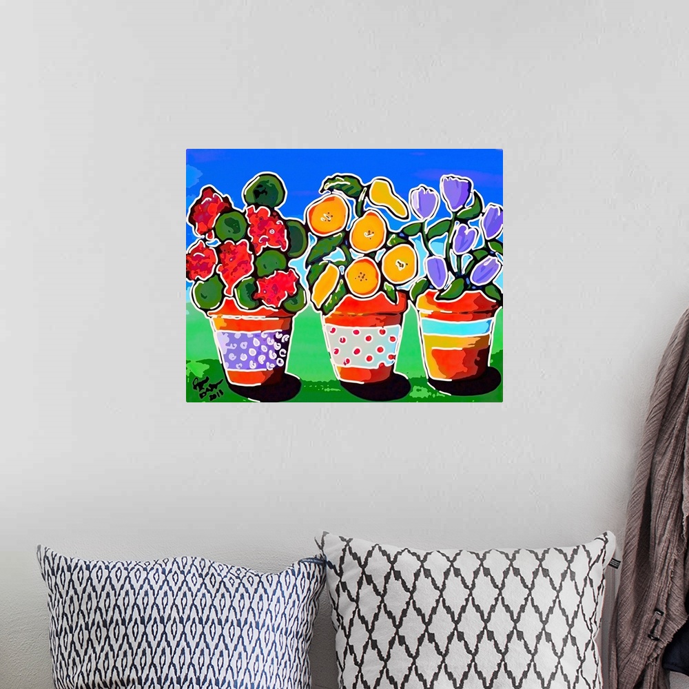 A bohemian room featuring Stylized version of folk art painting of 3 colorful, whimsical pots of flowers.