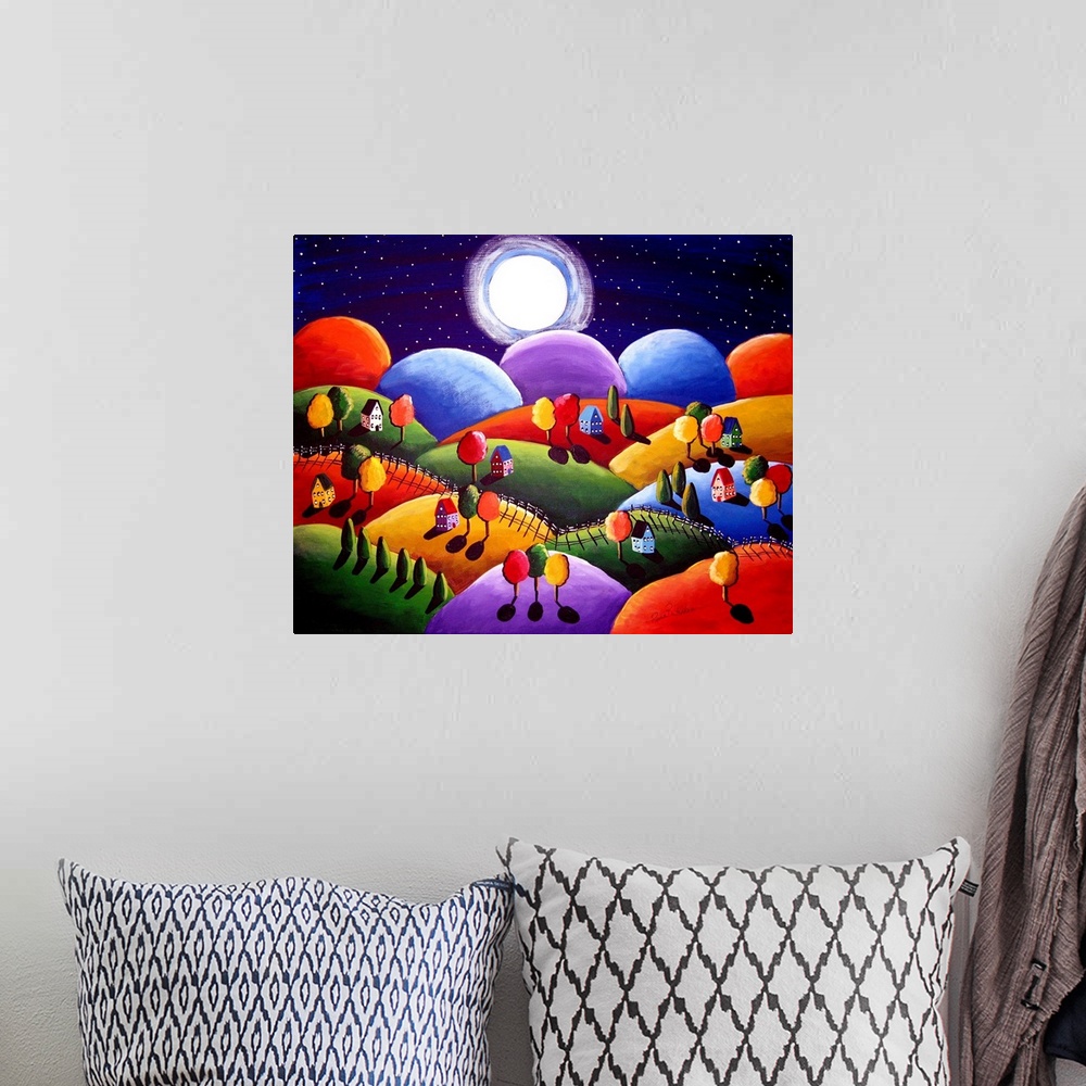 A bohemian room featuring Whimsical painting of cozy little houses and trees on rolling hills under a full moon sky.