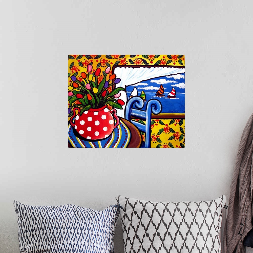 A bohemian room featuring Still life with tulips looking out of a window showing sailboats drifting by.