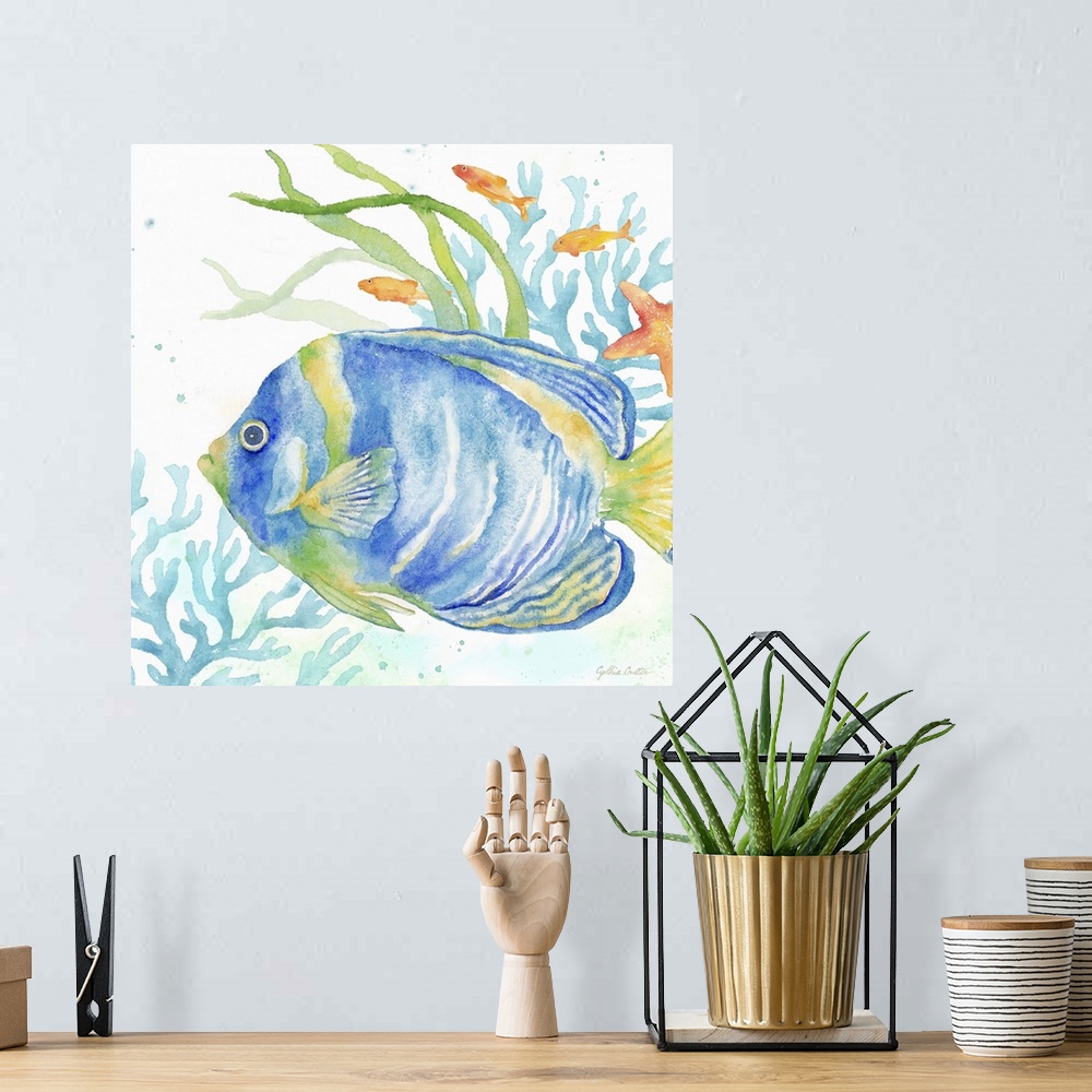 A bohemian room featuring An artistic watercolor painting of a fish and coral underwater in cool tones of blue and green.