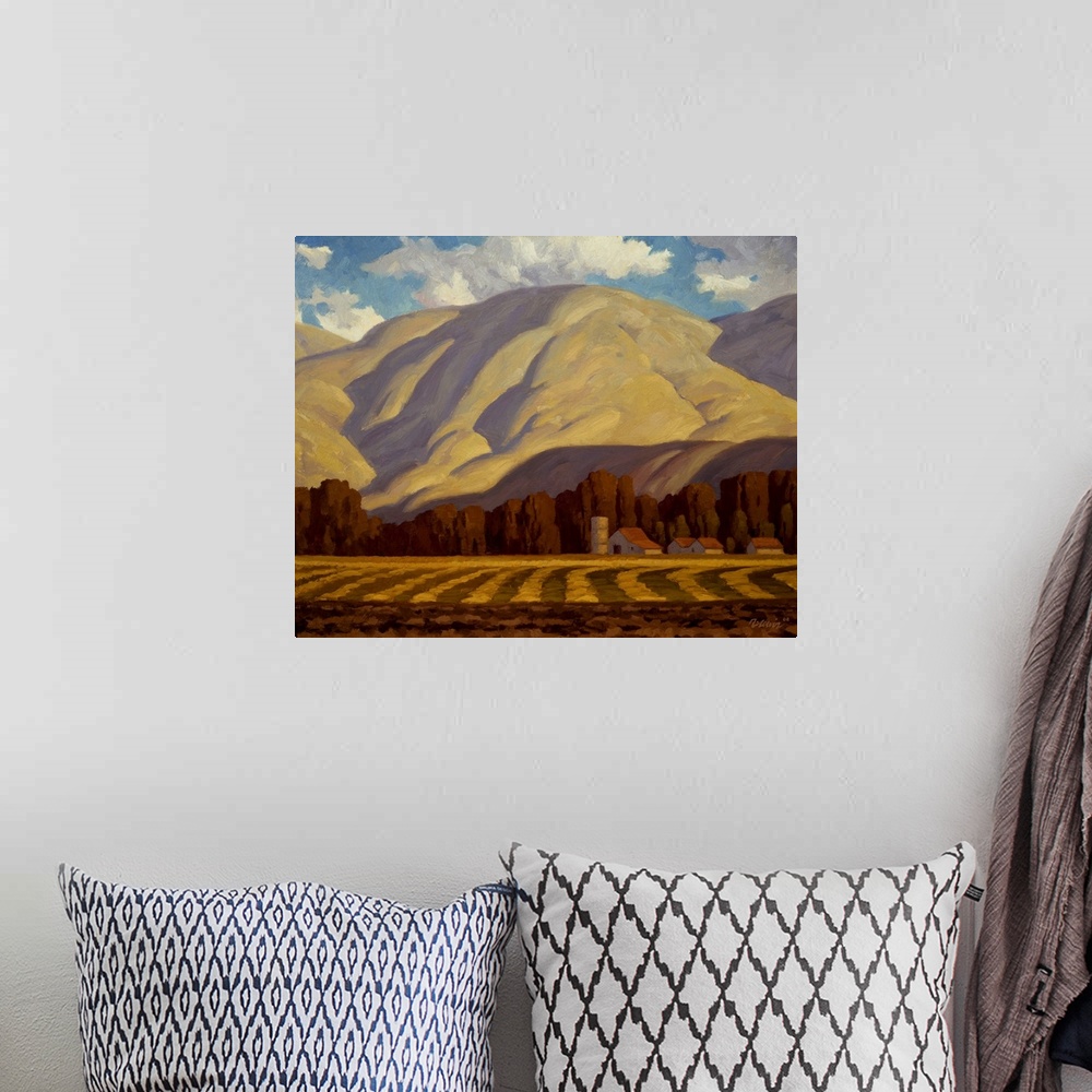 A bohemian room featuring Landscape painting of Chandler Farm with a mountain.