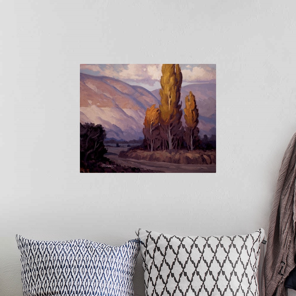 A bohemian room featuring Purple toned landscape painting of evening light on the Wasatch Mountains.