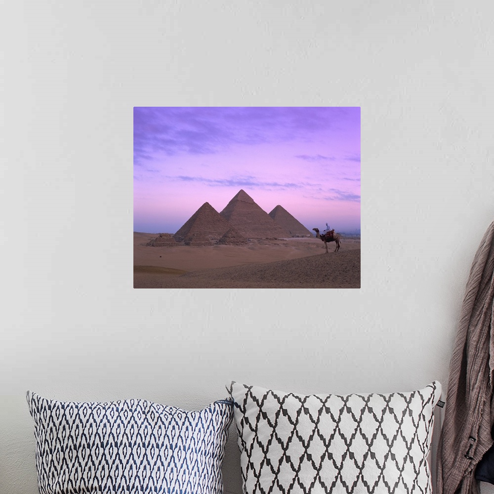 A bohemian room featuring Camel rider at Giza Pyramids, Giza, Cairo, Egypt, Africa
