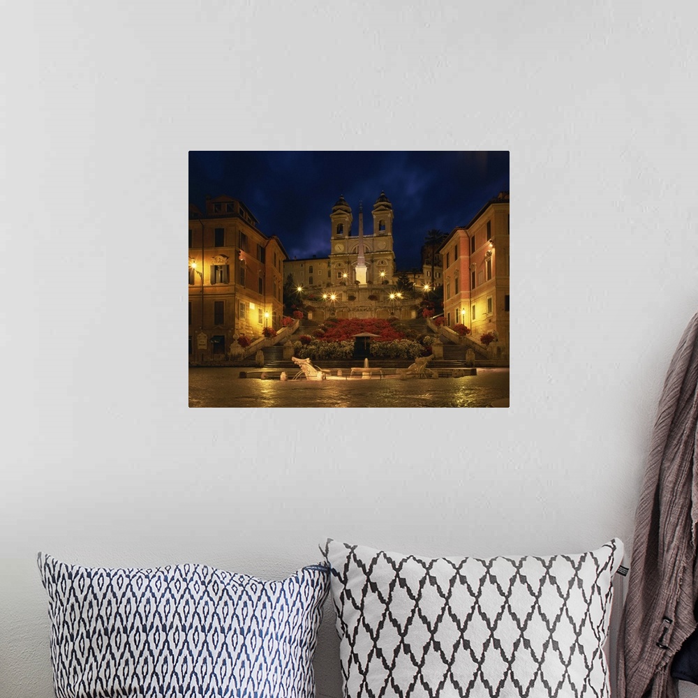 A bohemian room featuring The Spanish Steps illuminated at night in the city of Rome, Lazio, Italy