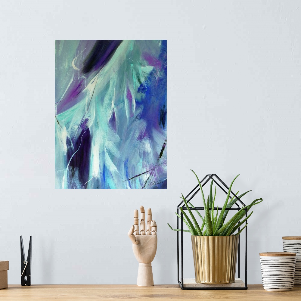 A bohemian room featuring Abstract painting created with shades of blue, purple, black, and white blended together.