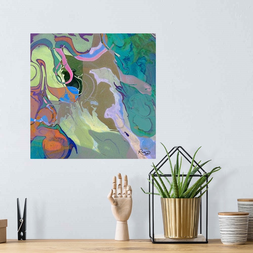 A bohemian room featuring Square abstract art with cool tones marbling together and made up of small, faint blotches of color.