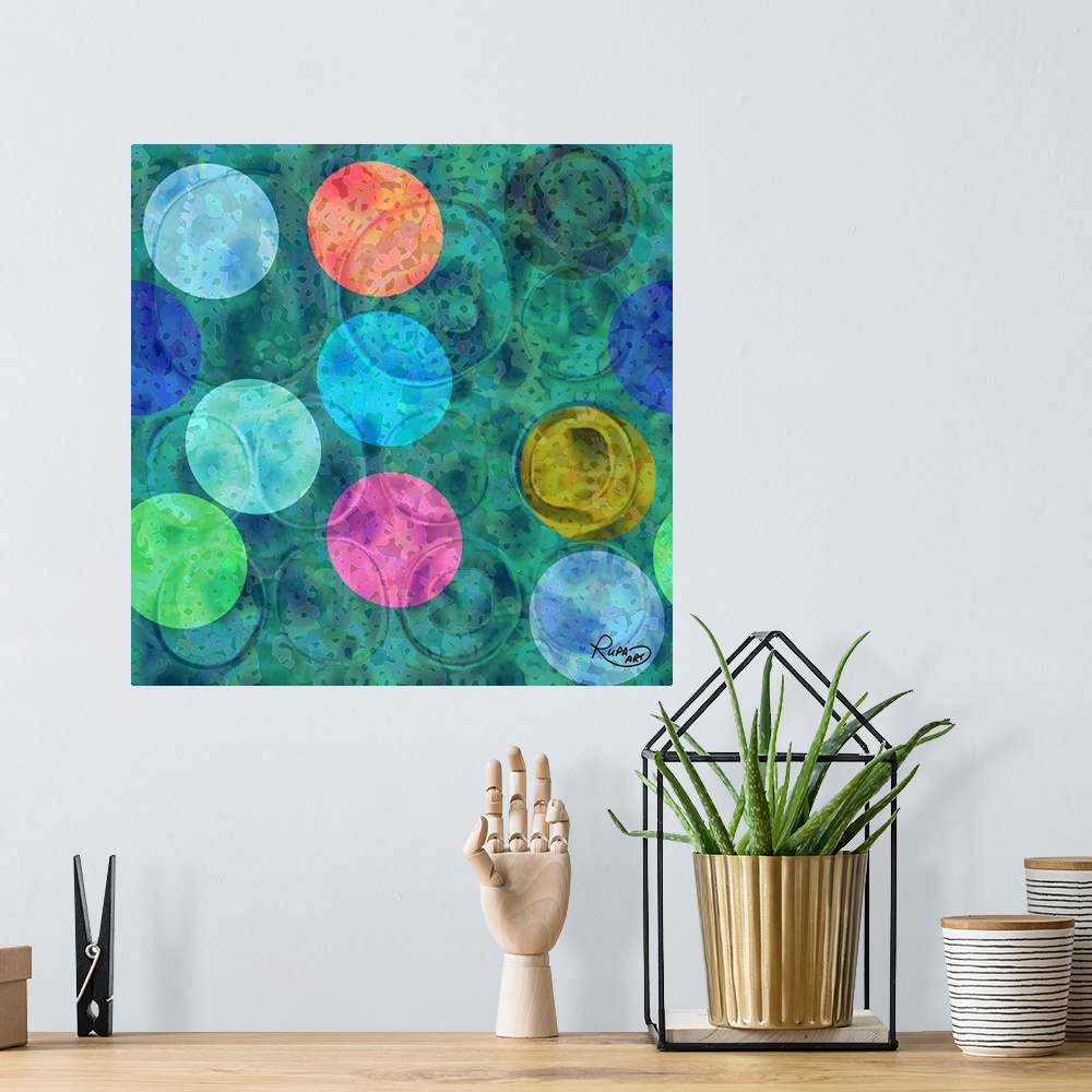 A bohemian room featuring Square abstract art with colorful circular shapes on top of a blue and green background.