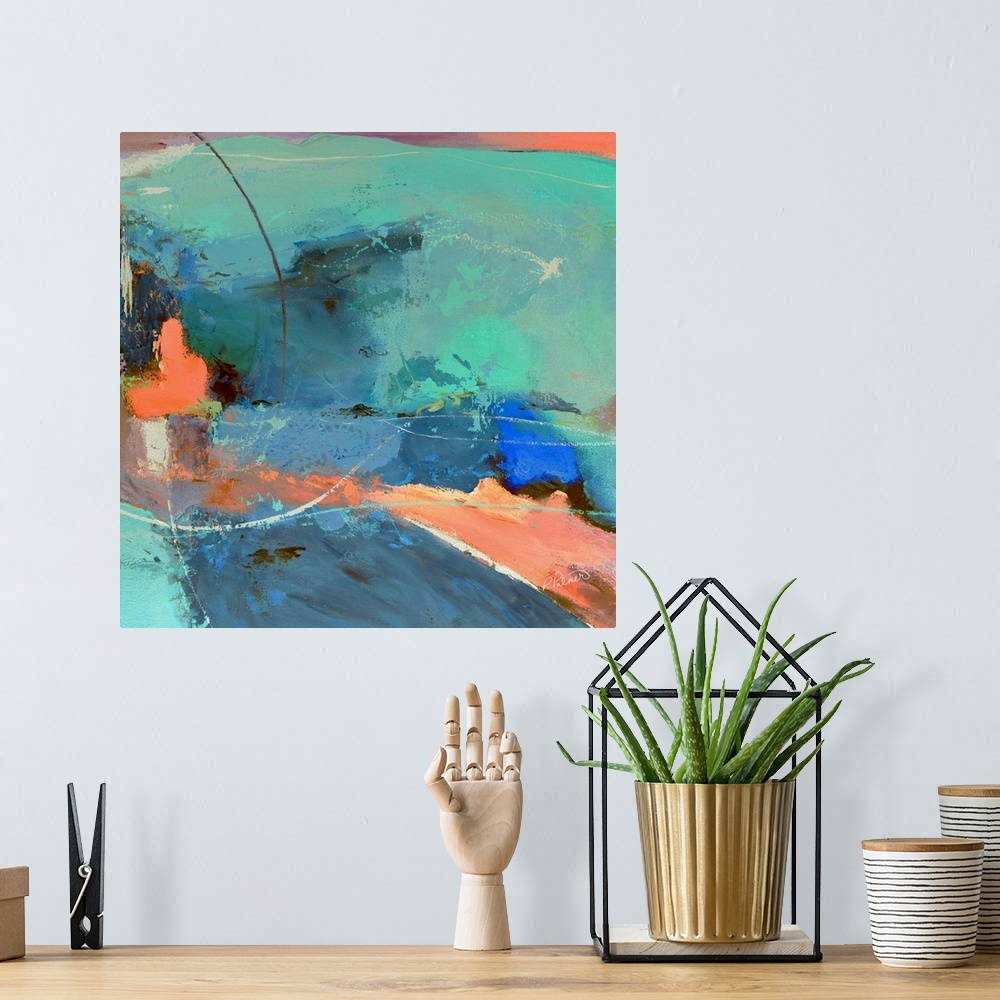 A bohemian room featuring Square abstract painting with pastel-like colors in shades of orange, blue, and green.