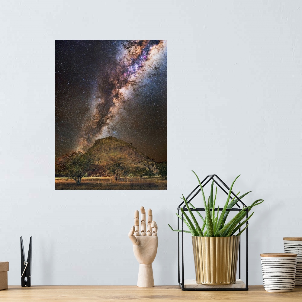 A bohemian room featuring Milky Way over a mountain, Namibia. The Milky Way is our galaxy seen from the inside, forming a b...