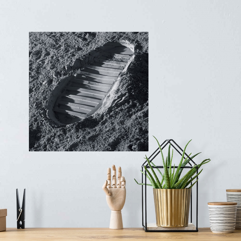 A bohemian room featuring Walking on the Moon. Computer illustration of an astronaut's bootprint on the surface of the Moon.