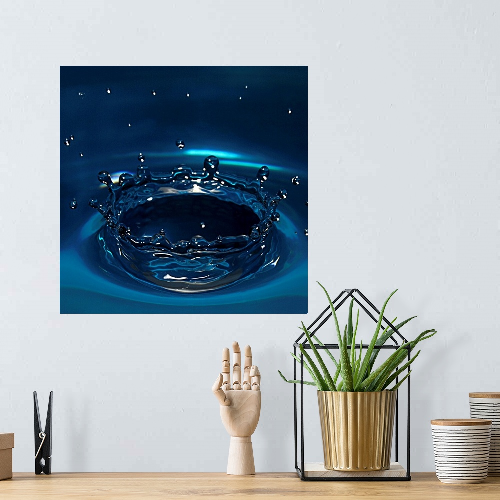 A bohemian room featuring Water drop impact on water surface.