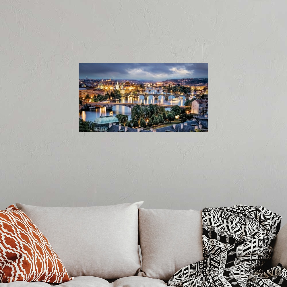 A bohemian room featuring Panorama of Vltava River and bridges in Prague at sunset