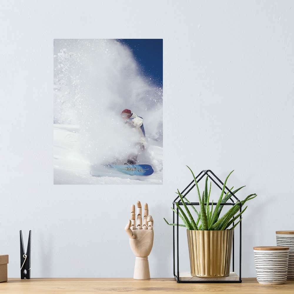 A bohemian room featuring Ian Spiro almost hidden in a cloud of snow, snowboarding at North Cascade Heli Skiing, Mazama, Wa...