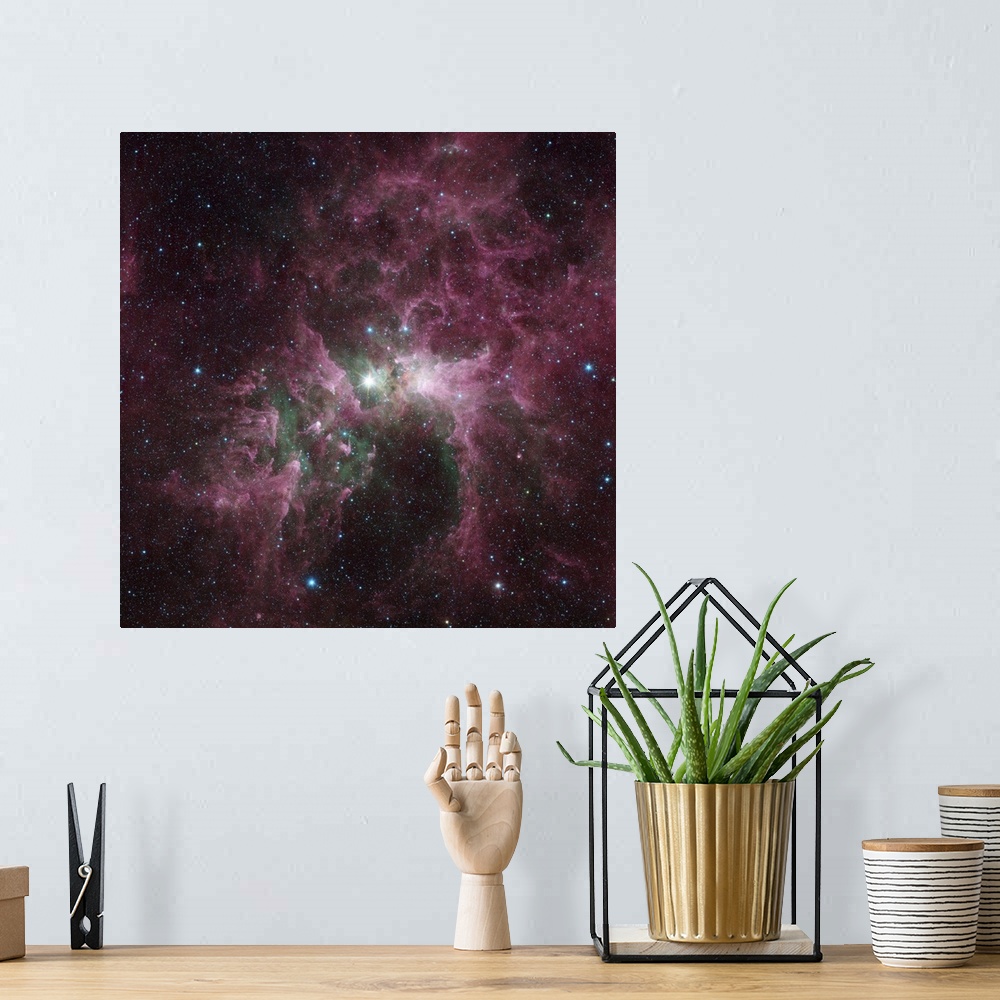 A bohemian room featuring Infrared view of the Carina Nebula. The bright star at the center of the nebula is Eta Carinae, o...