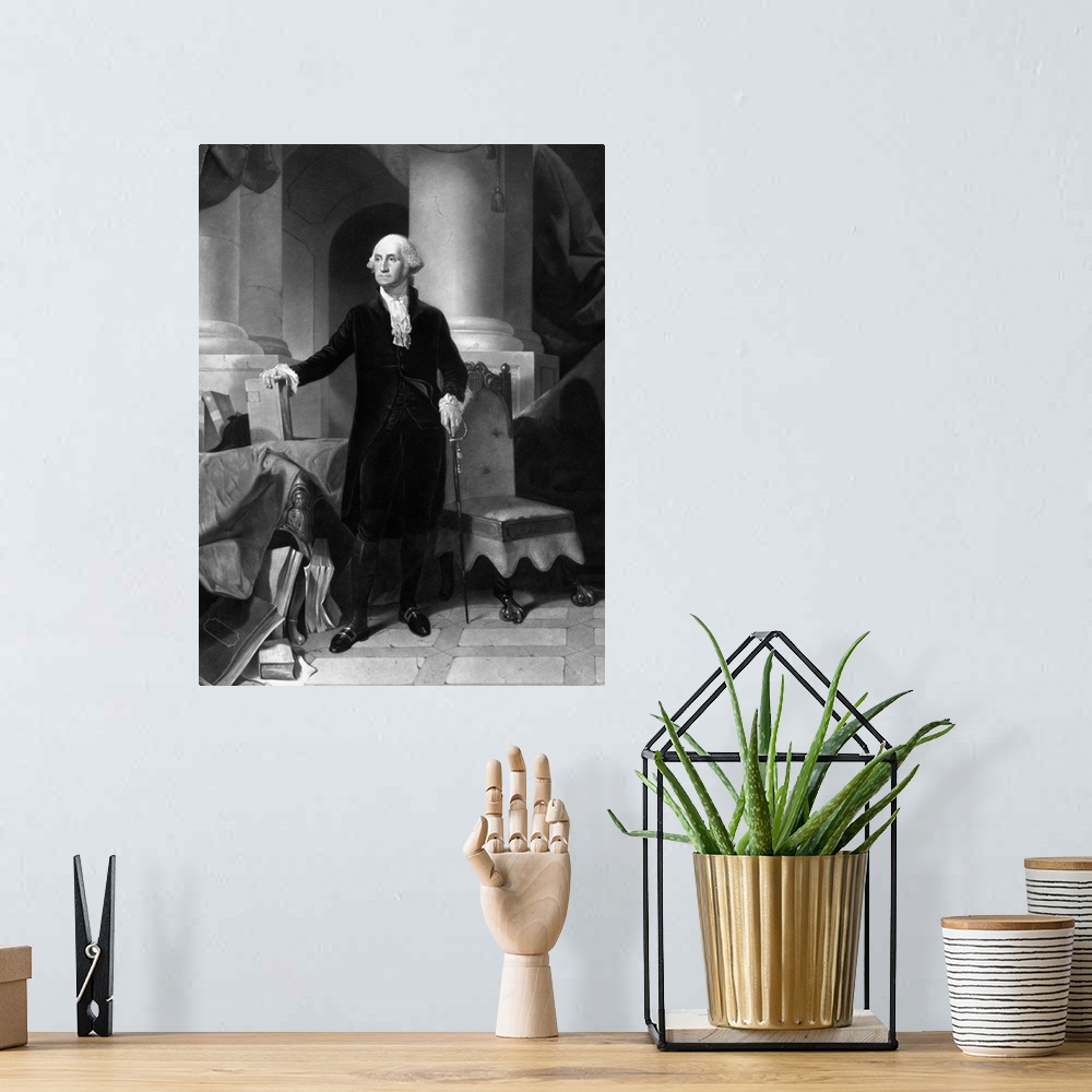 A bohemian room featuring Vintage American History print of President George Washington standing, with one hand on a book a...