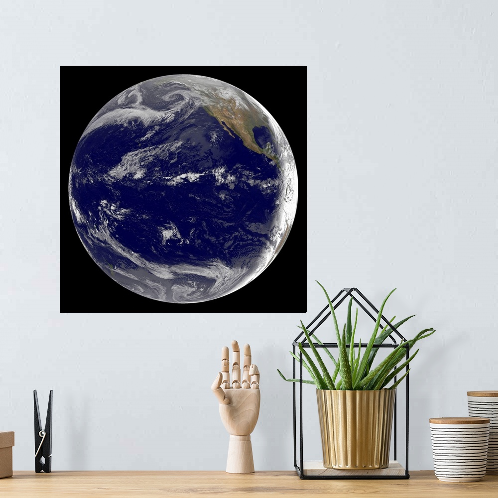 A bohemian room featuring Satellite image of Earth over the Pacific Ocean on March 11, 2011. Waves from the powerful 8.9 Ri...