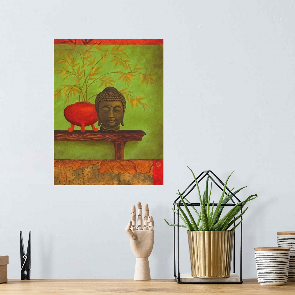A bohemian room featuring Asian style artwork of a bust of Buddha on a shelf with a red vase full of bamboo.