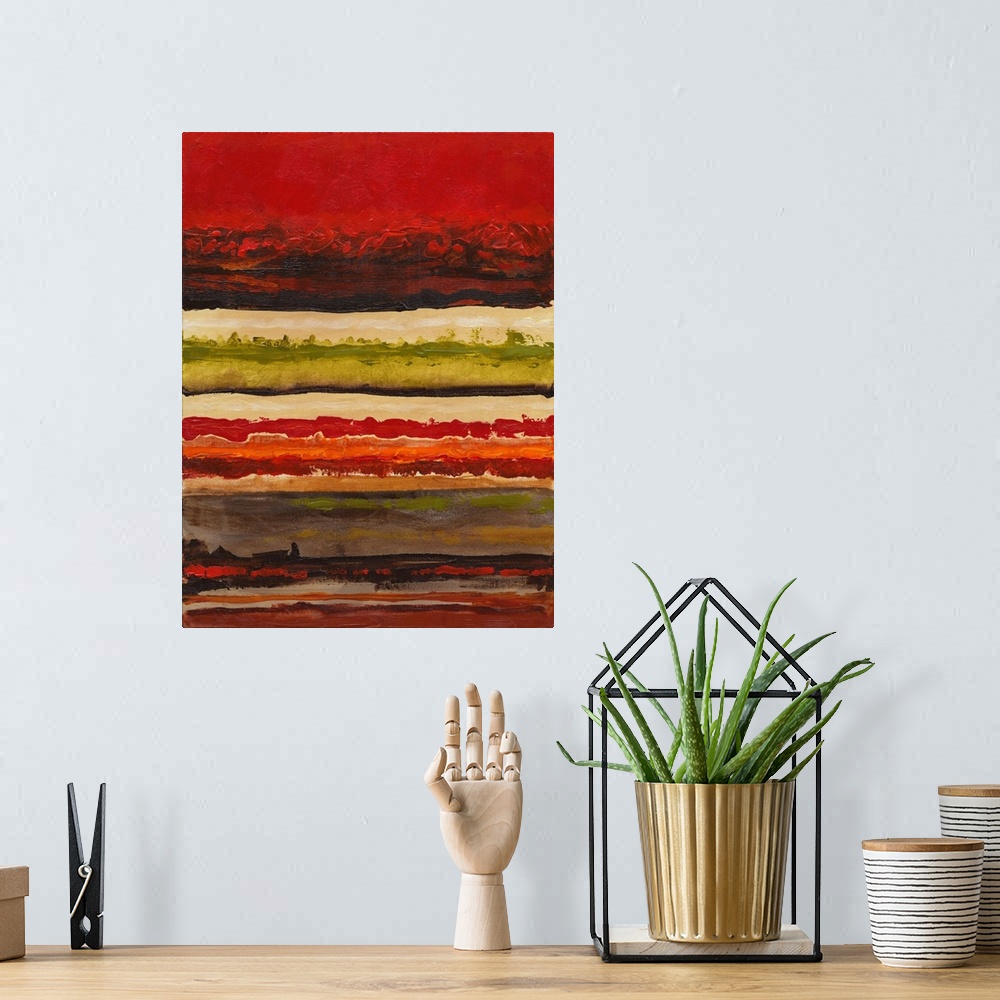A bohemian room featuring Abstract painting of horizontal layers in shades of red and green.