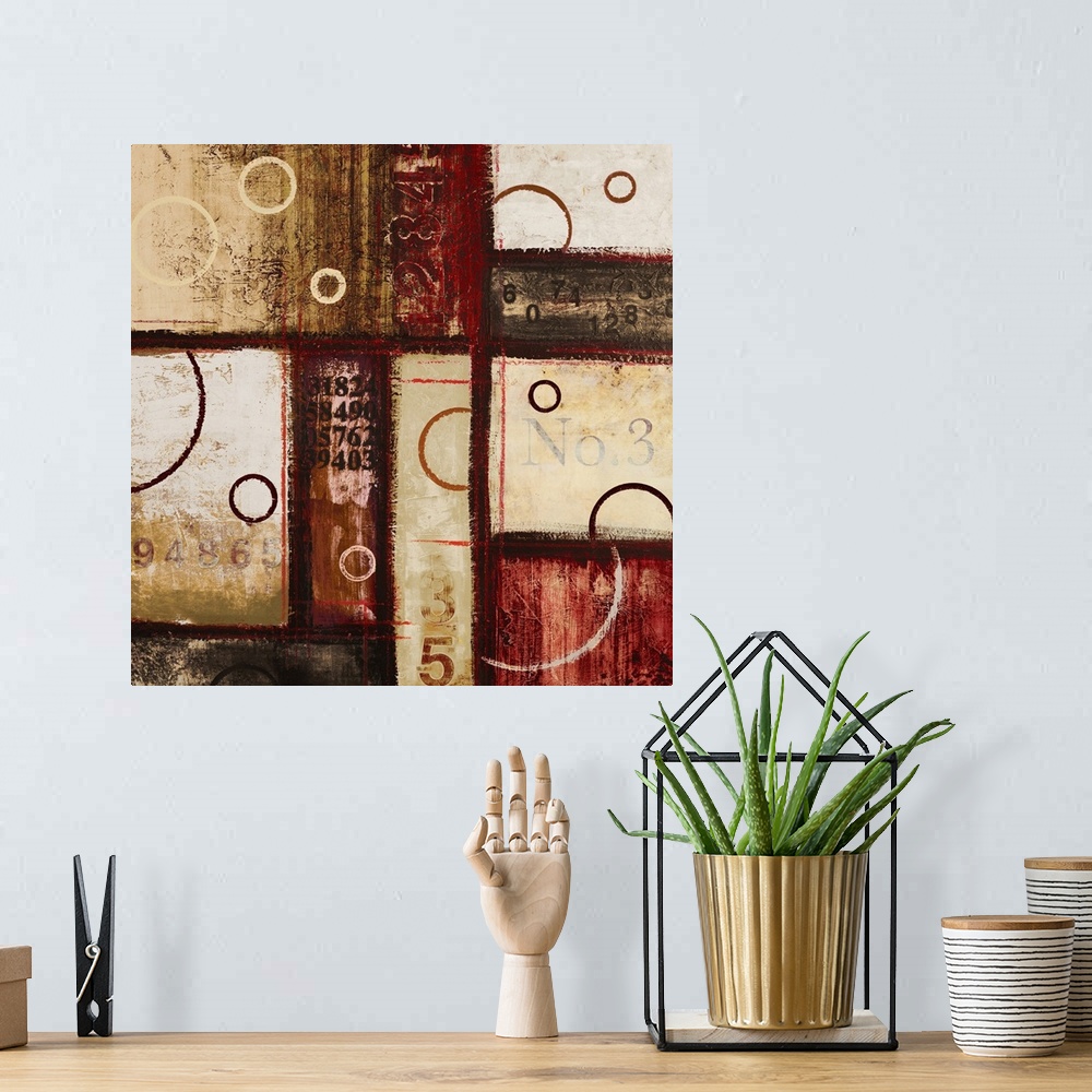 A bohemian room featuring Contemporary abstract art of blocks and circles of dark colors laid overtop of digital numbers.