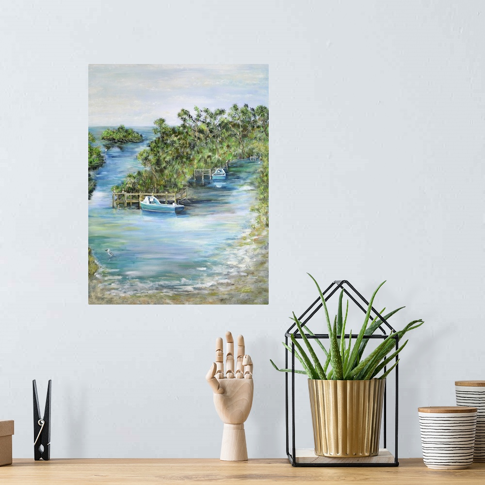 A bohemian room featuring Contemporary seascape artwork of boats docked at a tropical island.