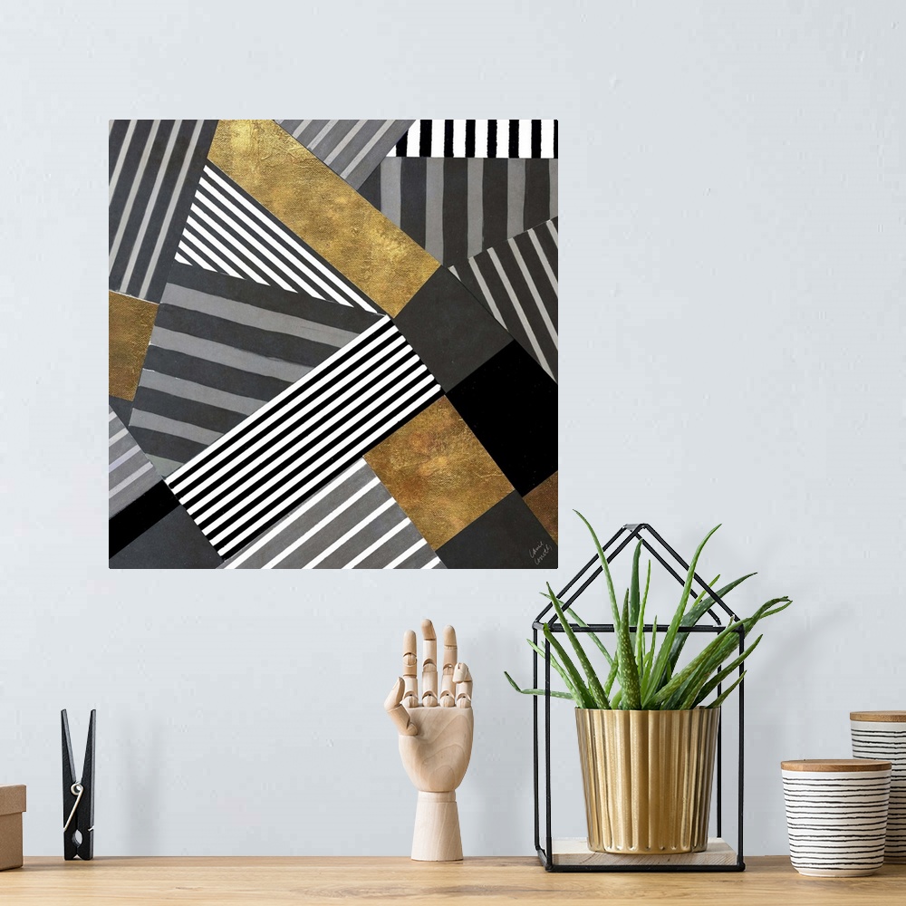A bohemian room featuring Square abstract painting that has black, white, and gray striped in sections moving in all differ...