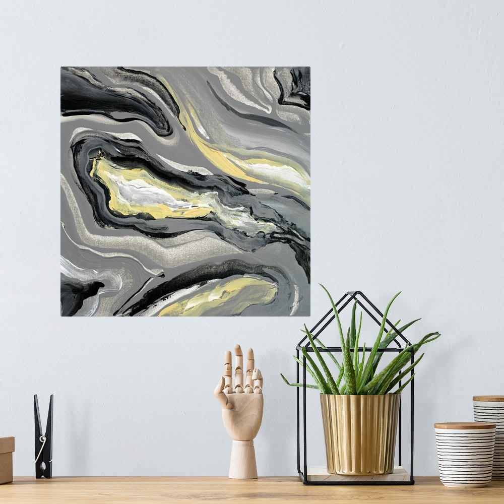 A bohemian room featuring Square abstract painting of a gray, yellow, and white geode.