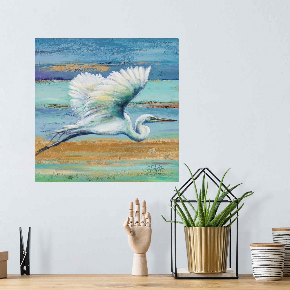 A bohemian room featuring Contemporary painting of a white egret in flight against a blue and green abstract background.