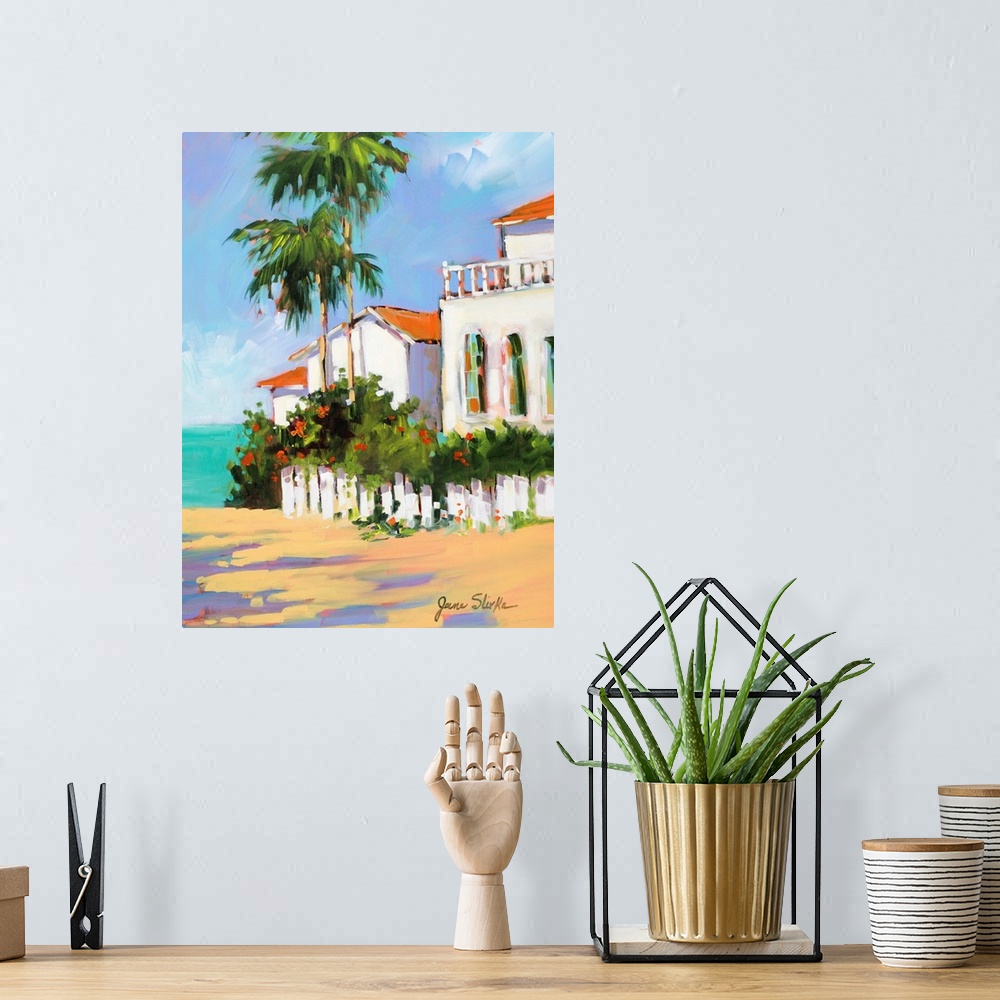 A bohemian room featuring Contemporary painting of a shore house with palm trees overlooking the ocean.
