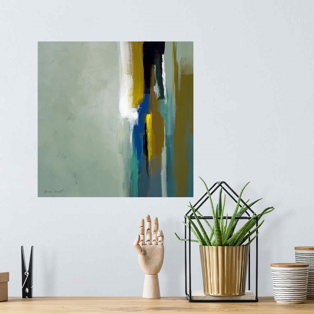 A bohemian room featuring Square abstract painted canvas with large brush strokes.