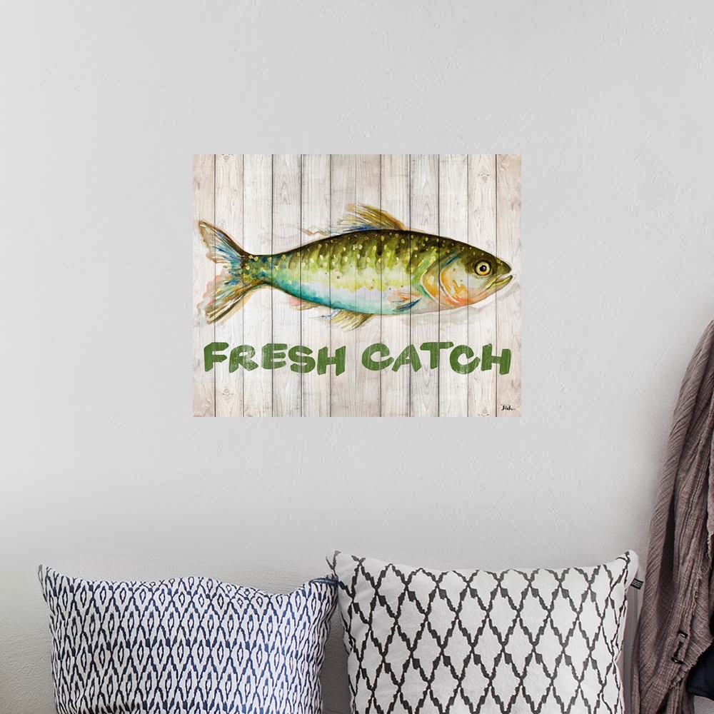 A bohemian room featuring Watercolor painting of a freshwater fish with "Fresh Catch" written below.