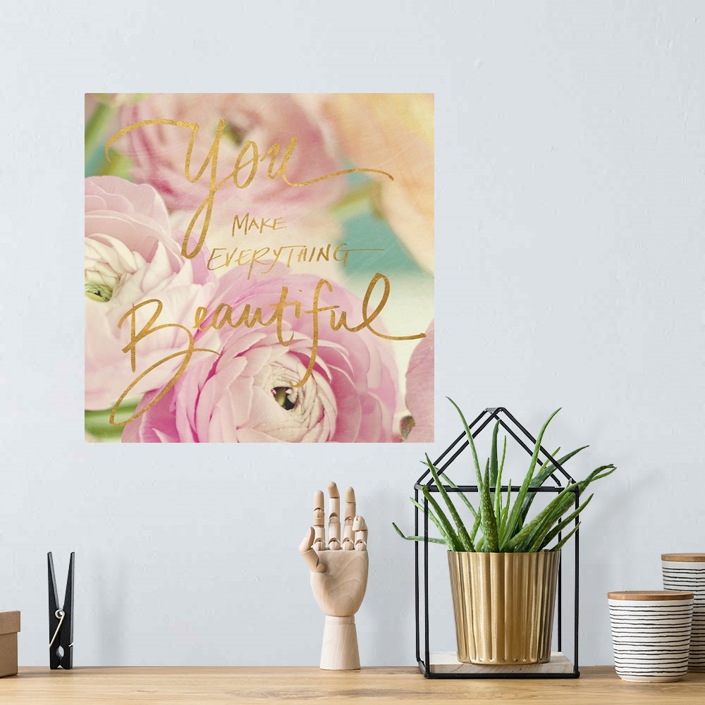 A bohemian room featuring Pastel-toned image of pink flowers with the phrase "You make everything beautiful" hand written o...