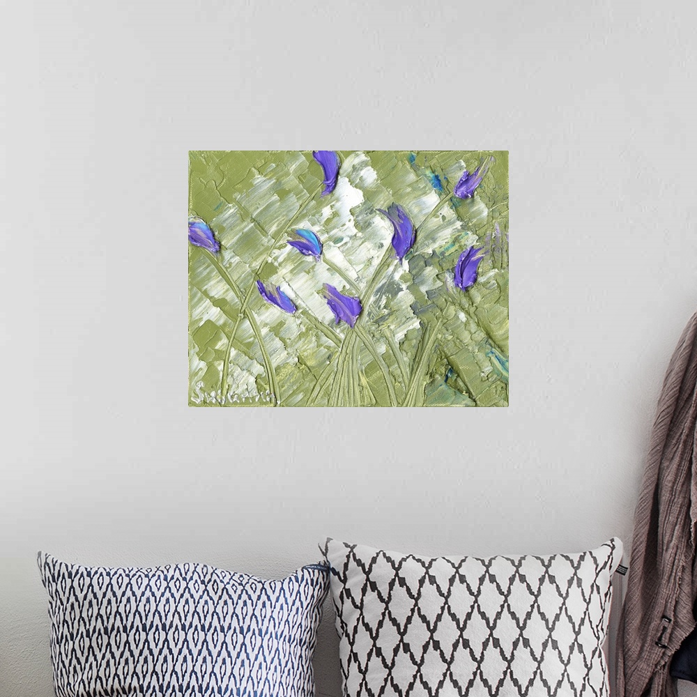 A bohemian room featuring Large abstract painting with purple tulips on sage green background.