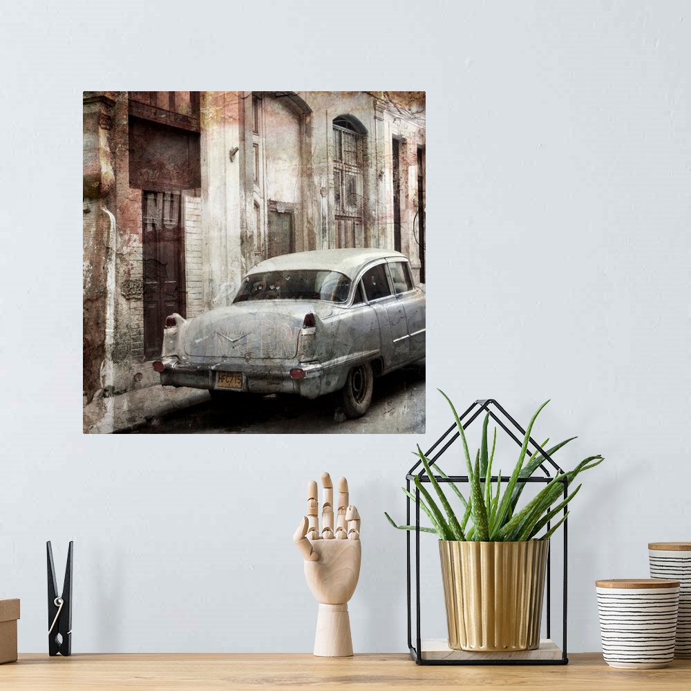 A bohemian room featuring Photograph of a vintage car parked on a street, next to decayed looking buildings.