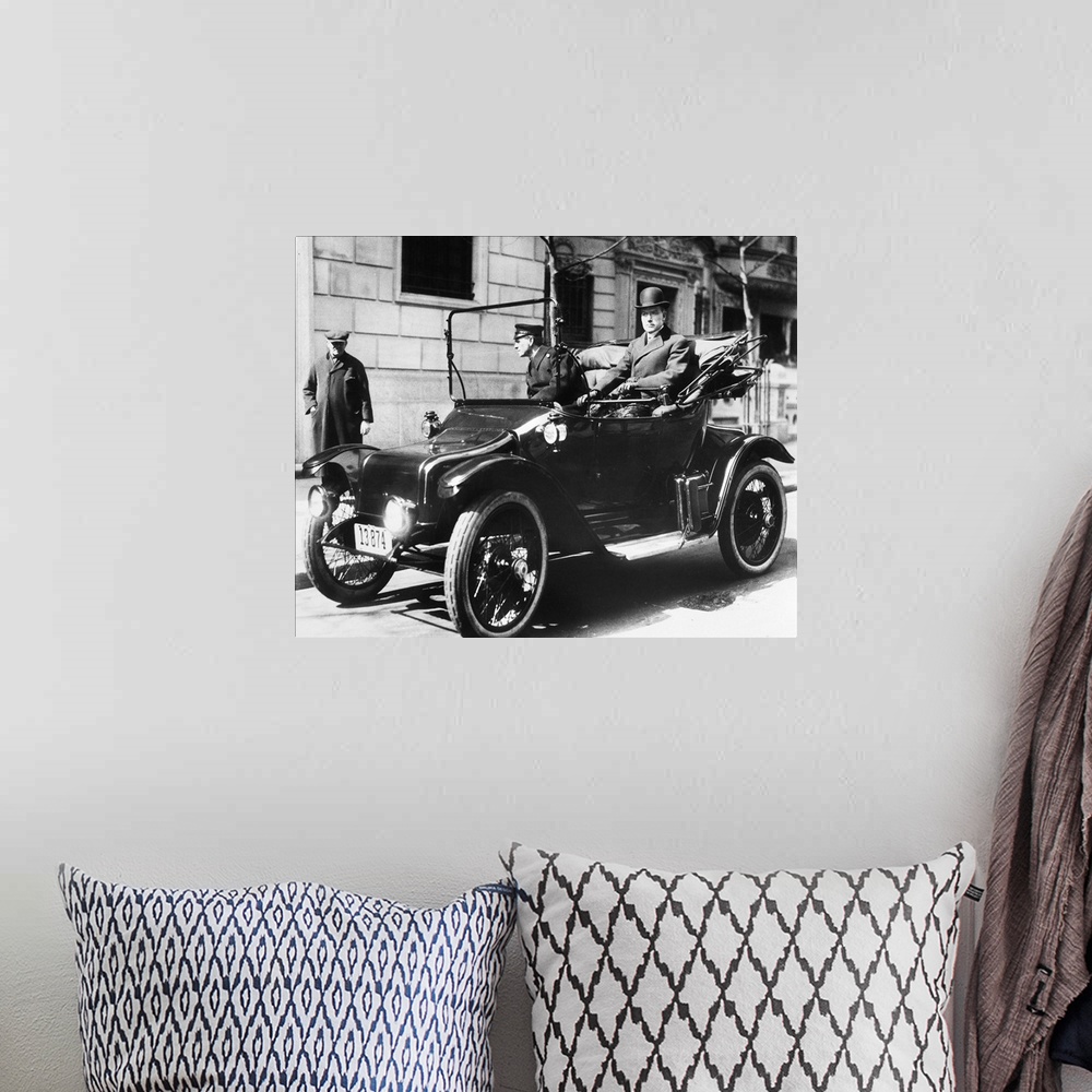 A bohemian room featuring (1839-1937). American oil magnate. Photographed in his electric car, 1920.